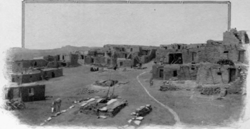 Black-and-white photograph of a ruined Native American settlement in the American Southwest.