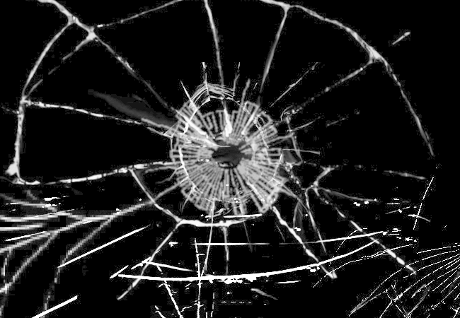 The cracks widen, forming the vague shape of an eye.