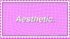The text 'aesthetic' on a pink grid background