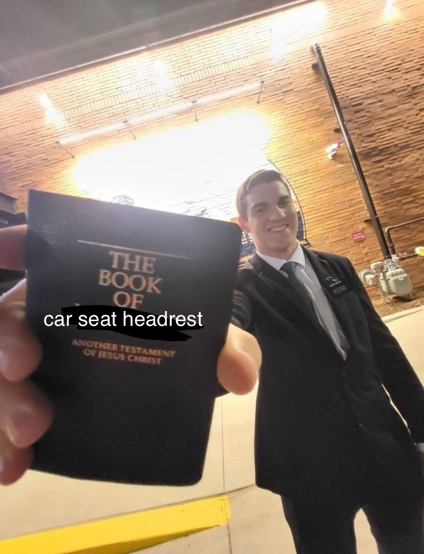 edited image of a man holding out the book of mormon. it has been edited so that the book of mormon is now called the book of car seat headrest.