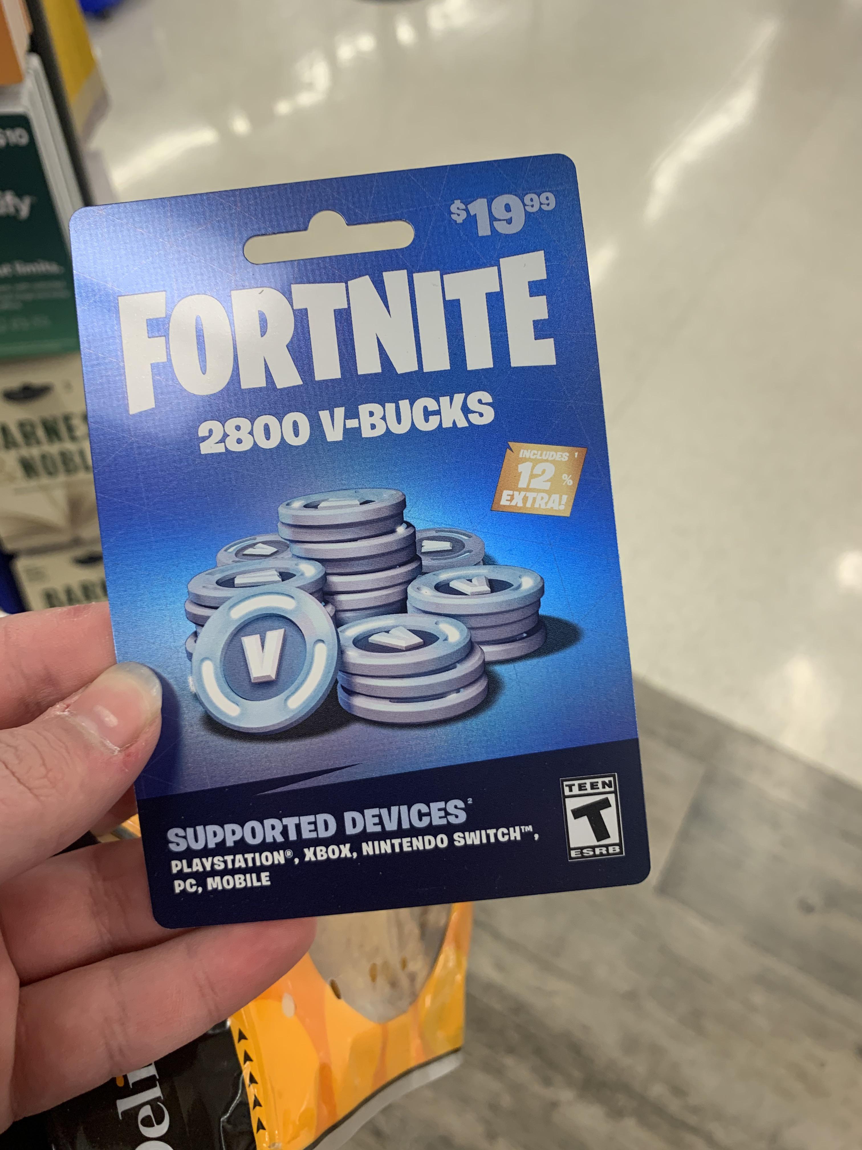 someone holds a fortnite gift-card for 2800 vbucks that costs $19.99