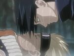 An image of Sasuke leaning over Naruto from their fight in the Valley of the End.