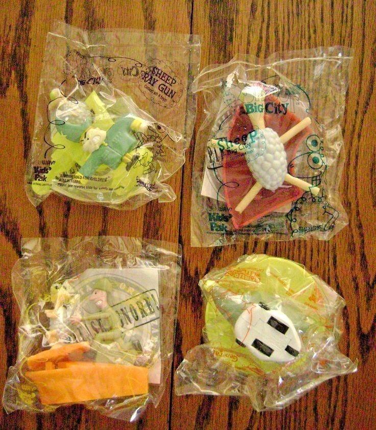 A picture of the 4 toys together, all wrapped in plastic.