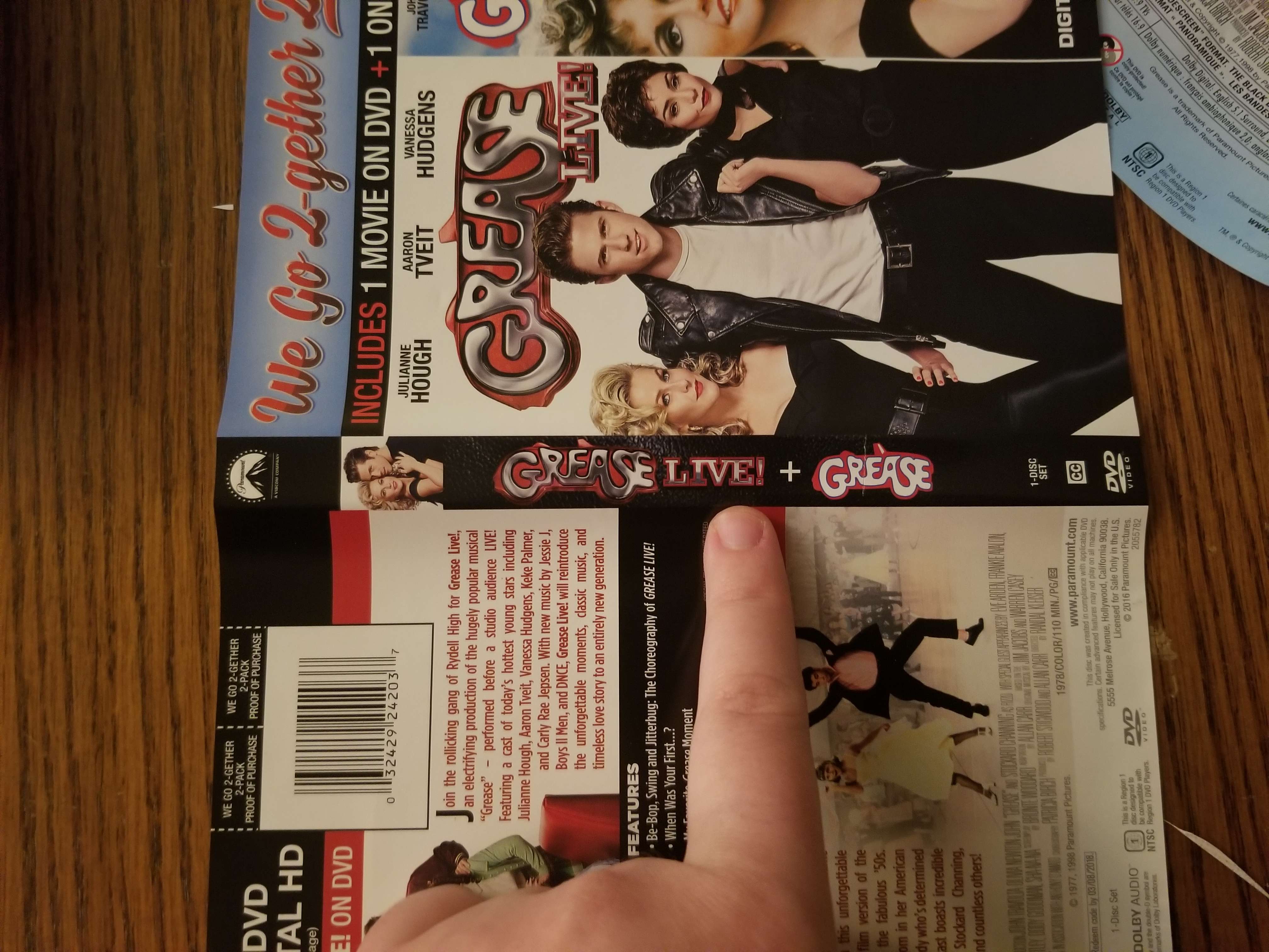 The spine of the Grease Live cover.