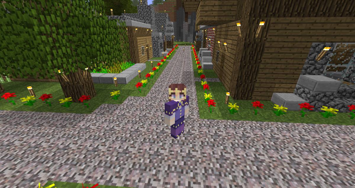 Franny's Minecraft character stands on the road of a village she has built in Alpha Minecraft.