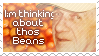 A deviantART styled stamp containing a photo of an elderly person's face to the right of white text reading "I'm thinking about those beans" with grammar, punctuation, and spelling mistakes. The background is a photo of baked beans. A deviantART styled stamp containing a photo of an elderly person's face to the right of white text reading "I'm thinking about those beans" with grammar, punctuation, and spelling mistakes. The background is a photo of baked beans.