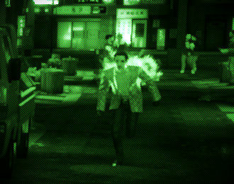 Image of Majima Goro running towards the camera. A green camera filter tints the image.