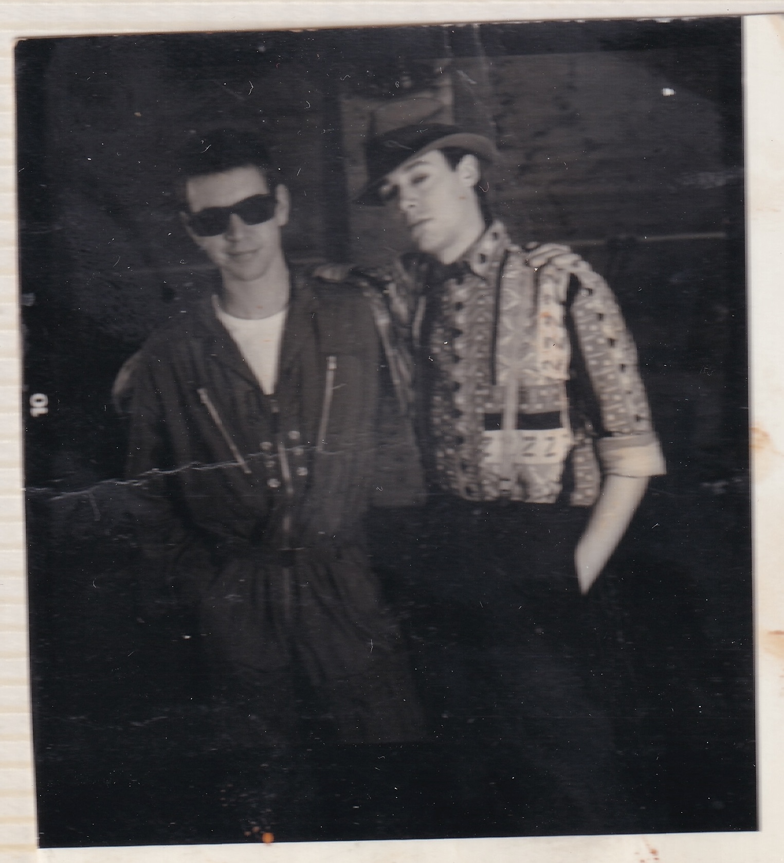 Stevie and Peter dressed up and standing arm to arm.