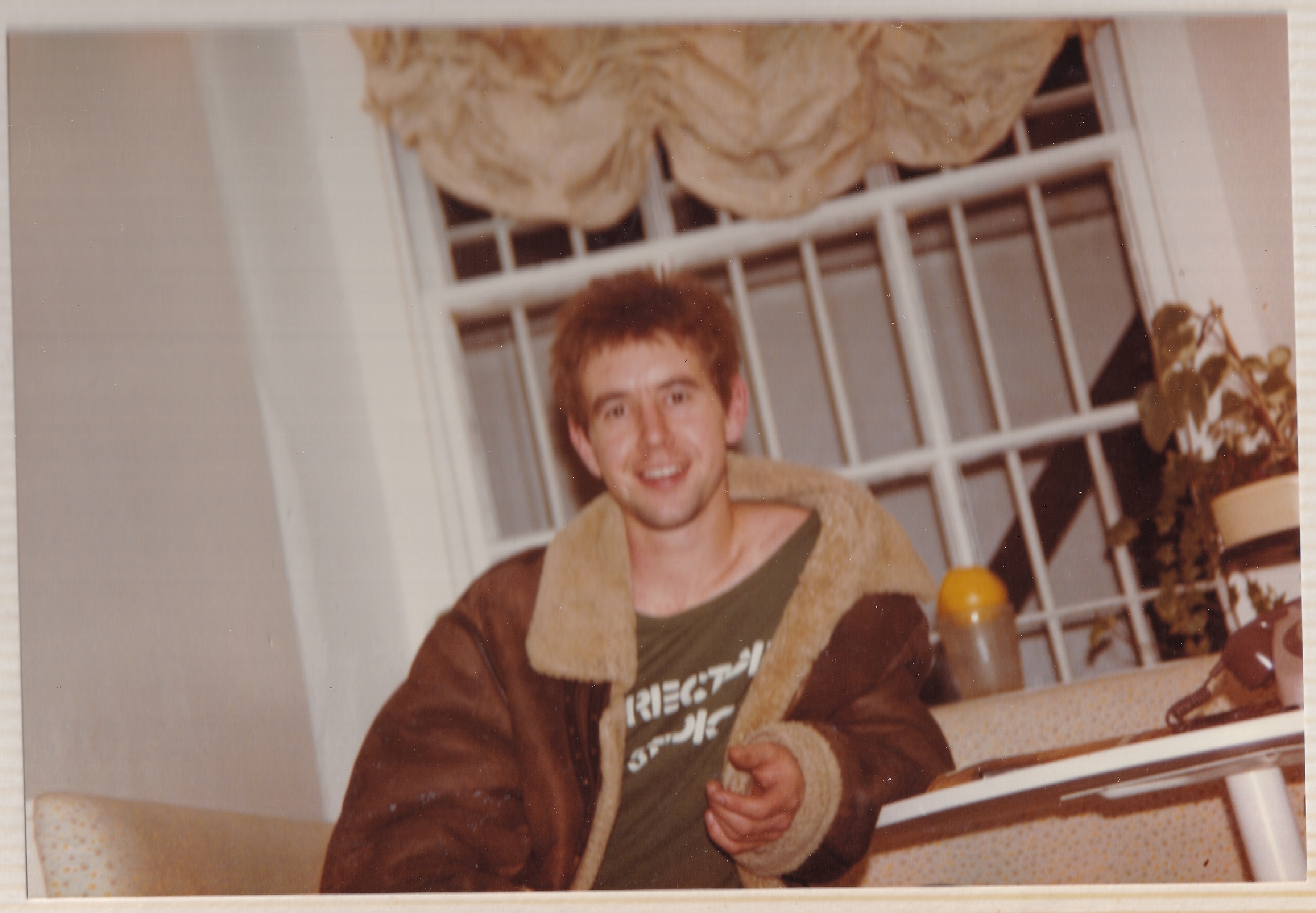 Stevie sitting and smiling.