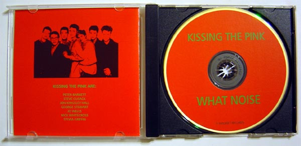 Unofficial CD release of What Noise folded out. On the left there's an image of the band without Sylvia in it. The list of band members below it includes Sylvia's name.