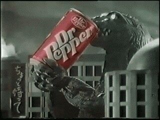 godzilla drinking a can of dr pepper