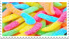 a stamp with an image of a pile of colorful gummy worms on it