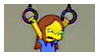A kid holding onto gym rings