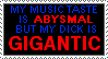 a black stamp with red and blue text reading 'my music taste is ABYSMAL but my dick is GIGANTIC'