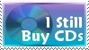 a stamp with a cd in the background with text reading 'i still buy cds'