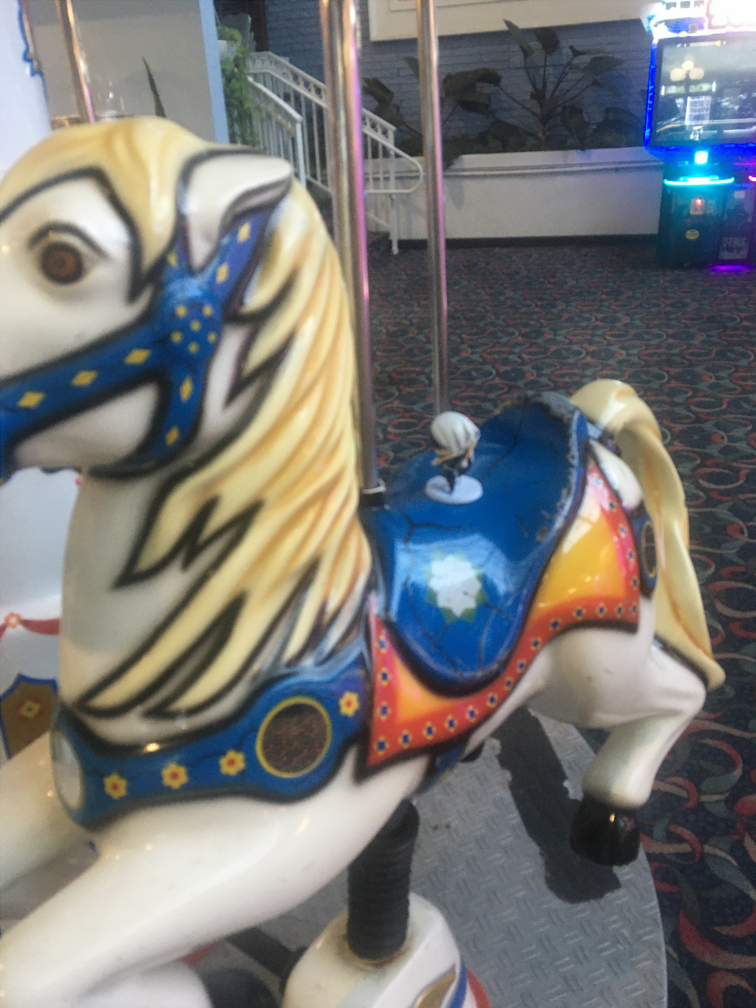 black rides a merry go round, yippee!