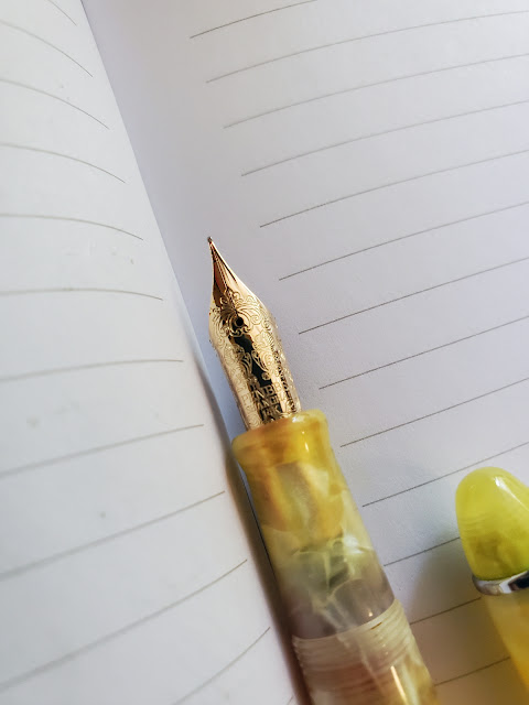 A close-up of the 14k gold nib, which has two mirrored Chinese lion-dogs engraved into it, along with beautiful decorative designs.