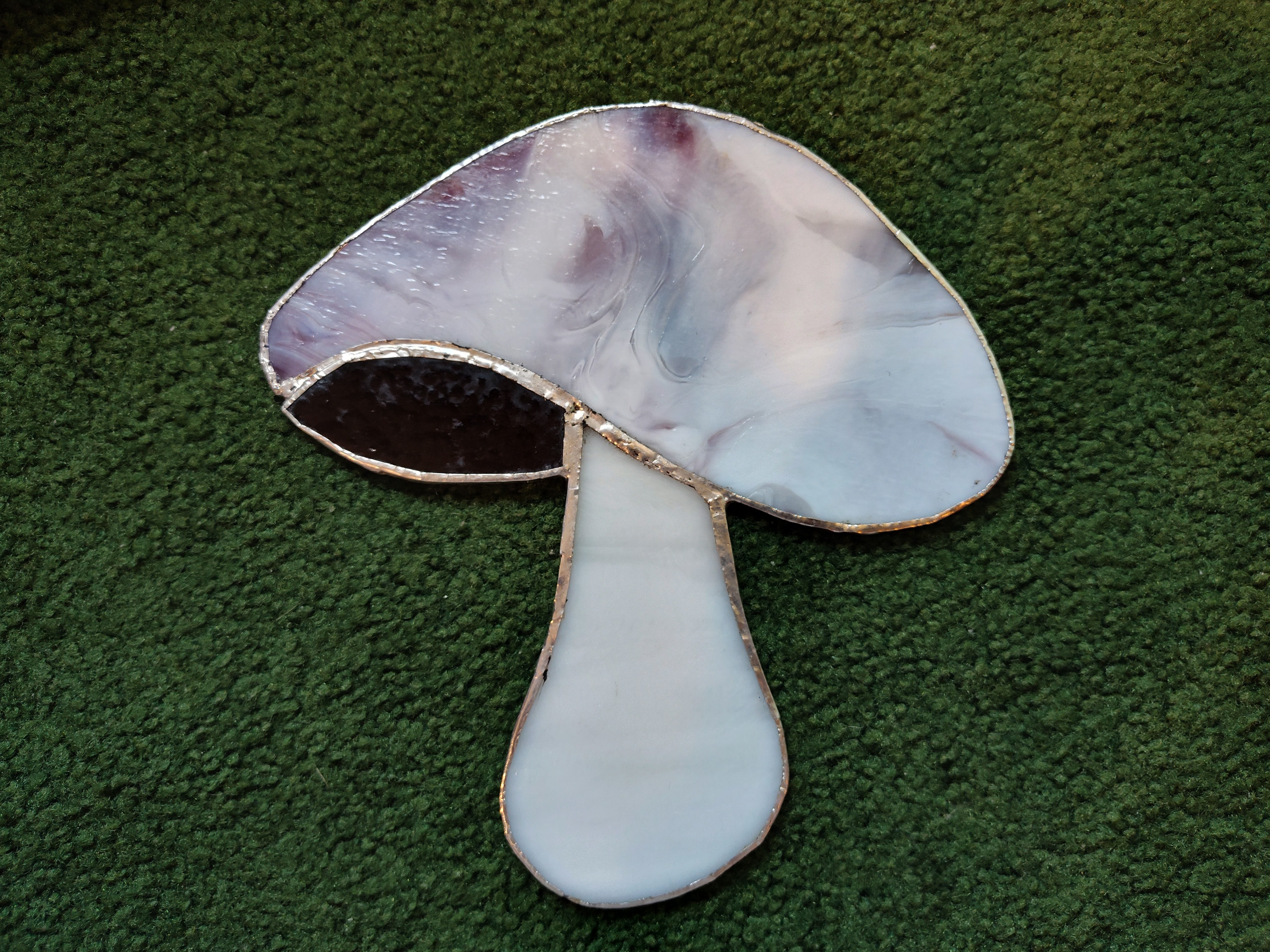 A purple stained glass mushroom.