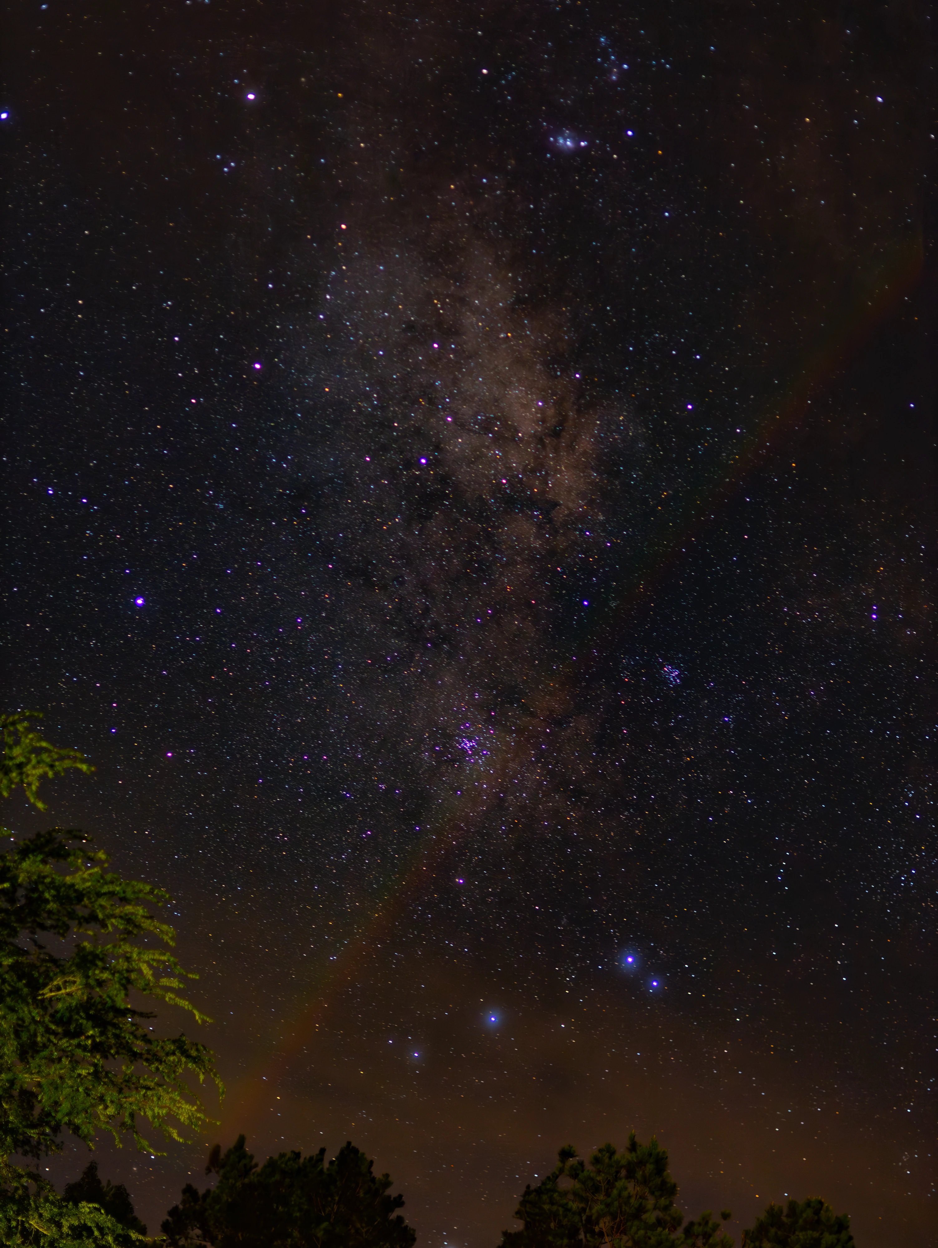 Rich purple Milky Way above a dark foreground