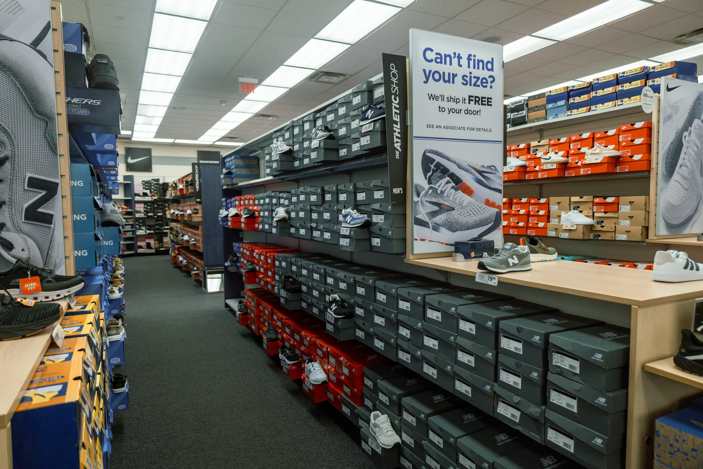 Branded footwear aisle inside Rack Room Shoes