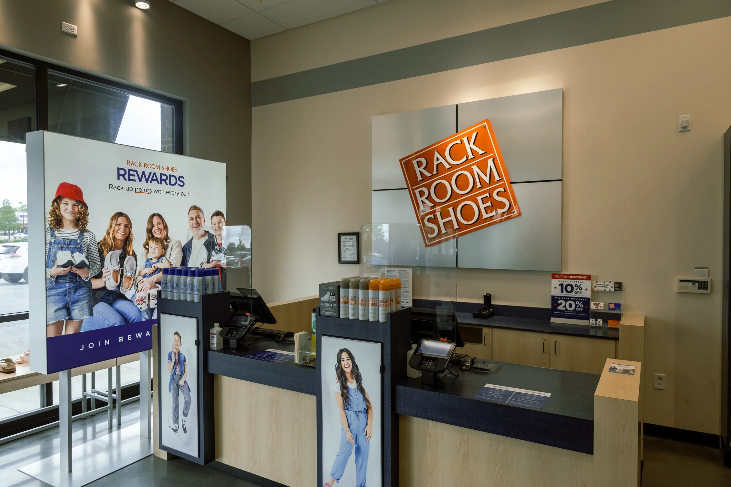Checkout area and customer-facing signage at Rack Room Shoes