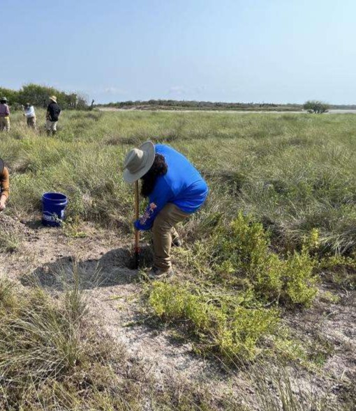 An archaeologist digging.