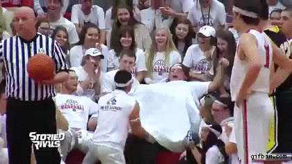 Fans fake deliver a baby to distract a free throw shooter