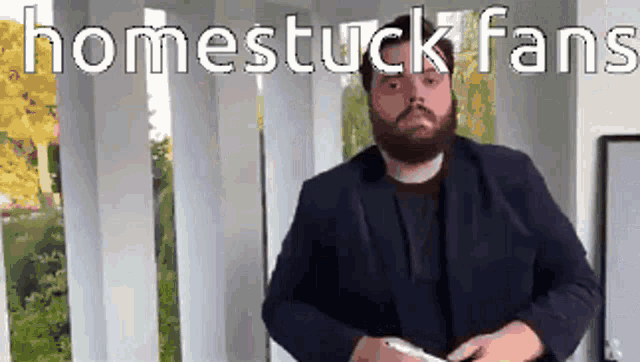 gif of a guy frantically writing on a whiteboard with the caption"homestuck fans"