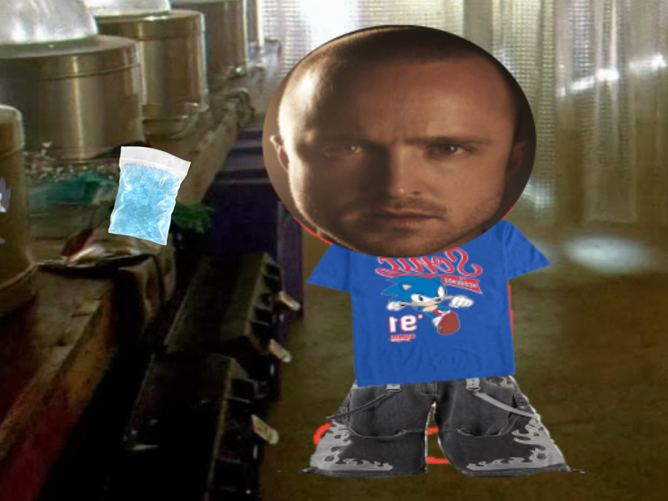 Jesse stands next to a bag of Blue meth on the counter.