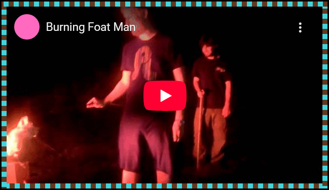 The thumbnail of a youtube video titled "Burning Foat Man". Two people are seen standing next to a fire burning out of frame.