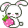 White rabbit holding a strawberry.