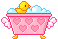 A pink bubble bath with a rubber duck