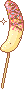 A banana on a stick with sprinkles.