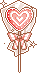 A glittery pink heart lolipop.