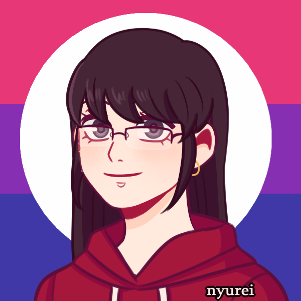 woman with glasses in front of bisexual pride flag