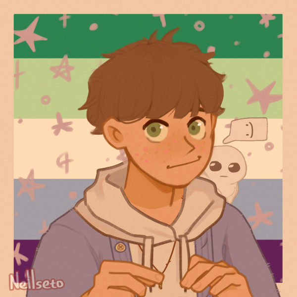 smiling boy with slightly raised hands in front of gay pride flag