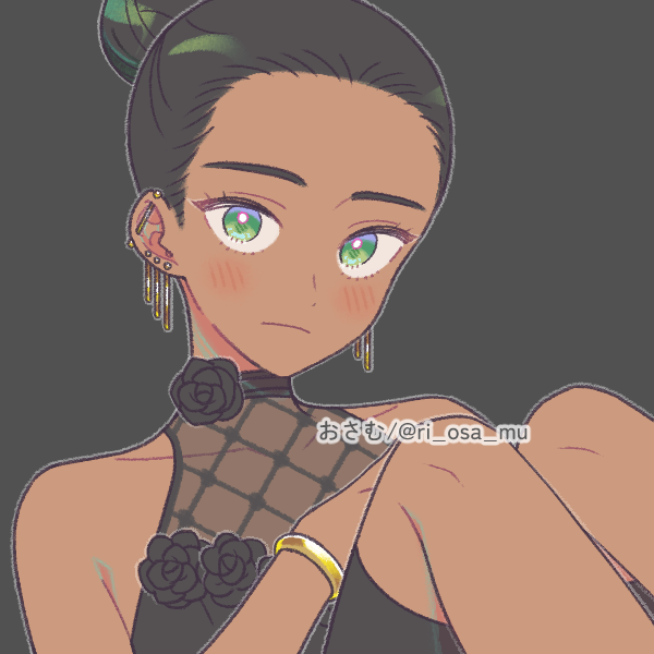 feminine agender person with hair tied back in bun wearing black dress and gold bracelet
