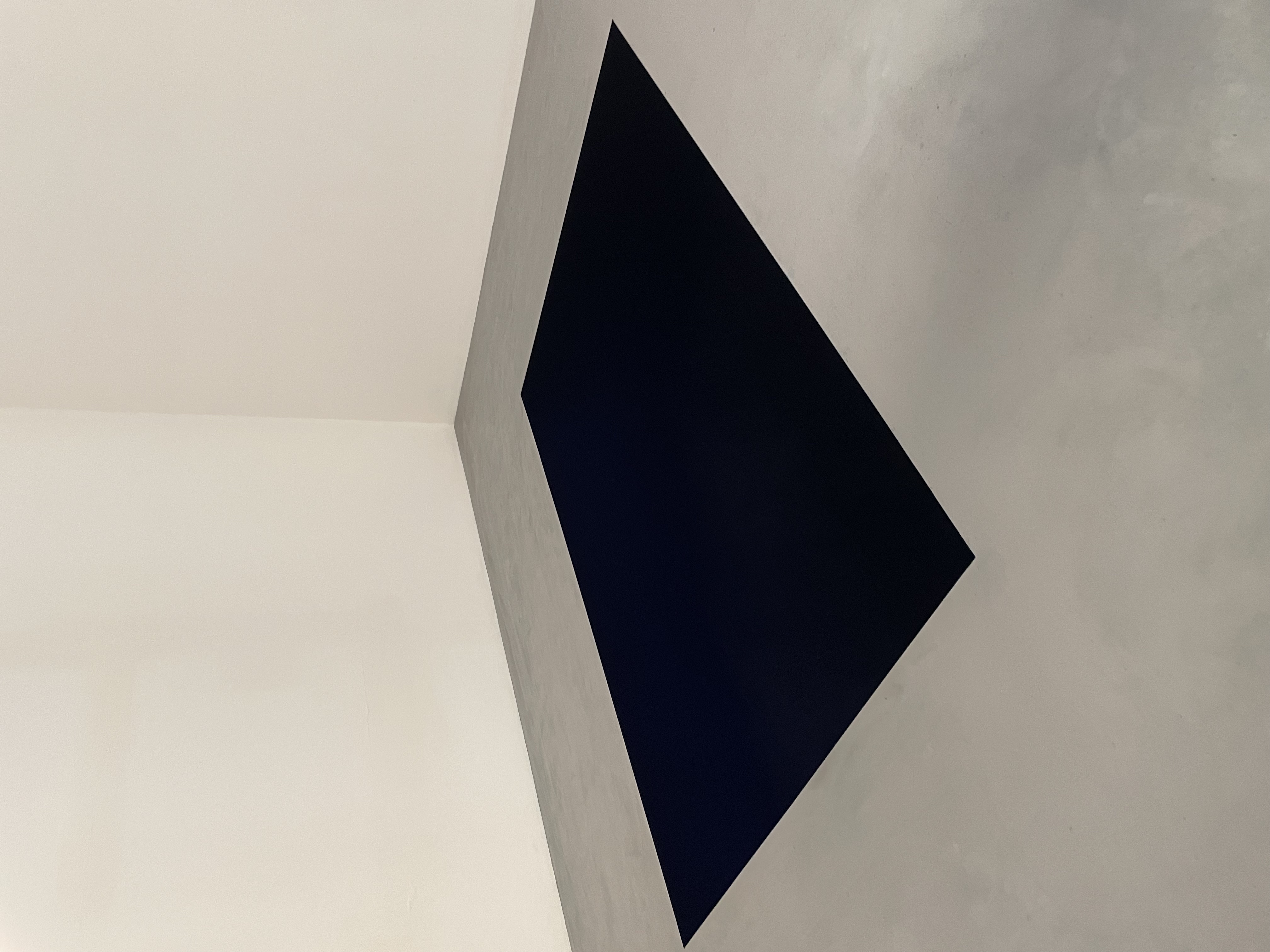 Black rectangle hole on the floor, seemingly bottomless.