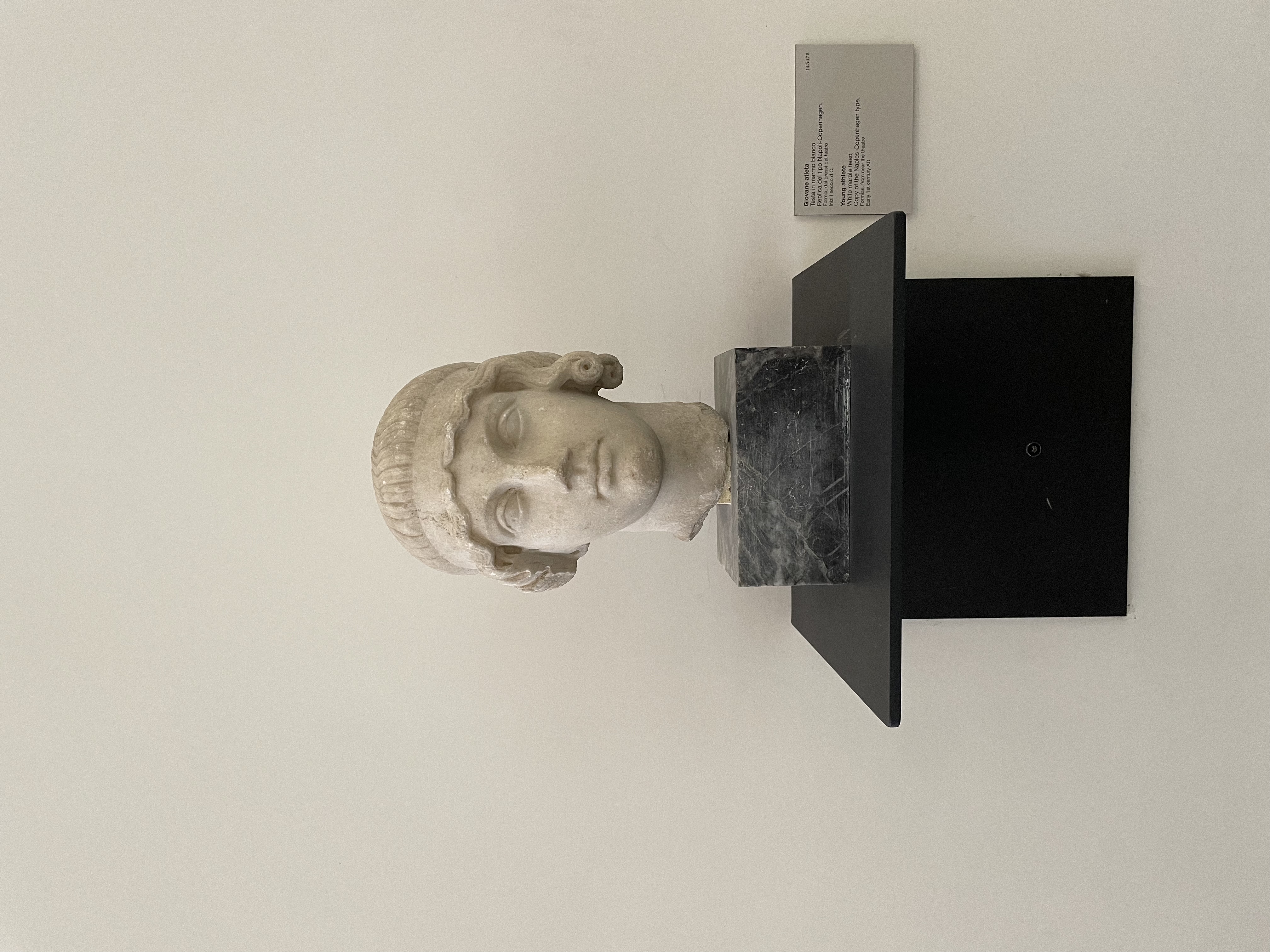 White marble head of a young athlete.