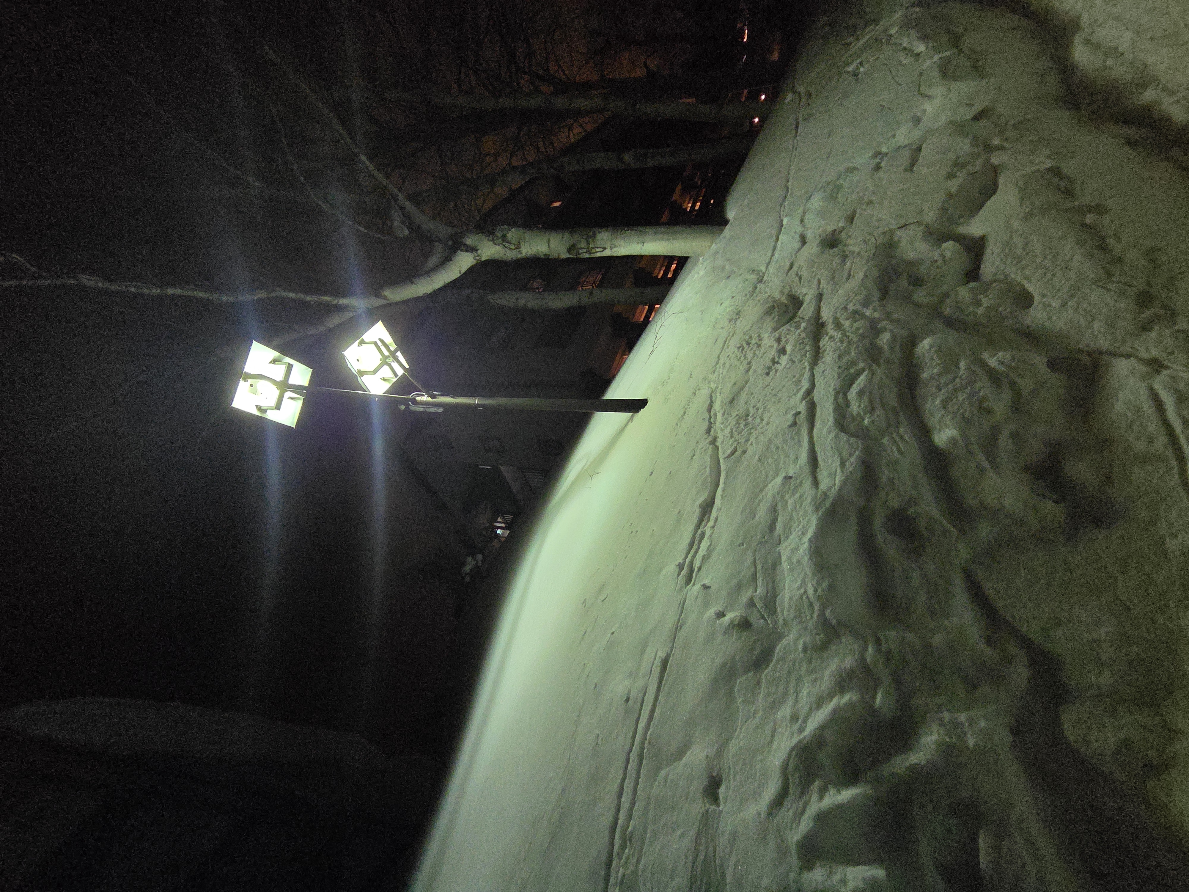 Snow halfway up a lightpole