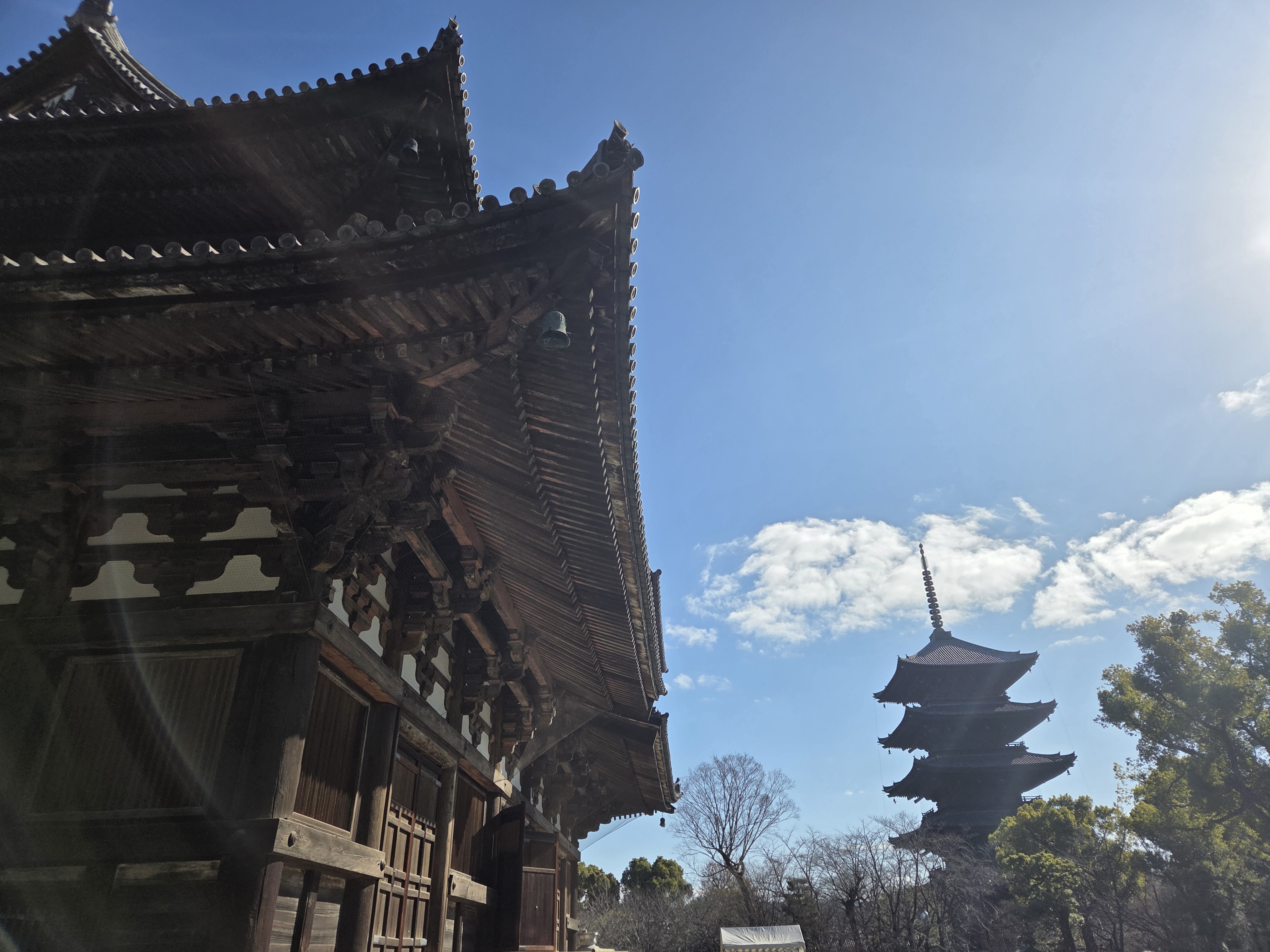 Under the shade of the Kondo (golden hall) View from under the Kondo looking at the Toji-ji (tower)