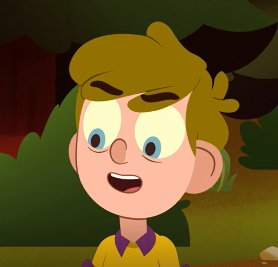 a young boy with blond-greenish hair and dark eyebrows smiling