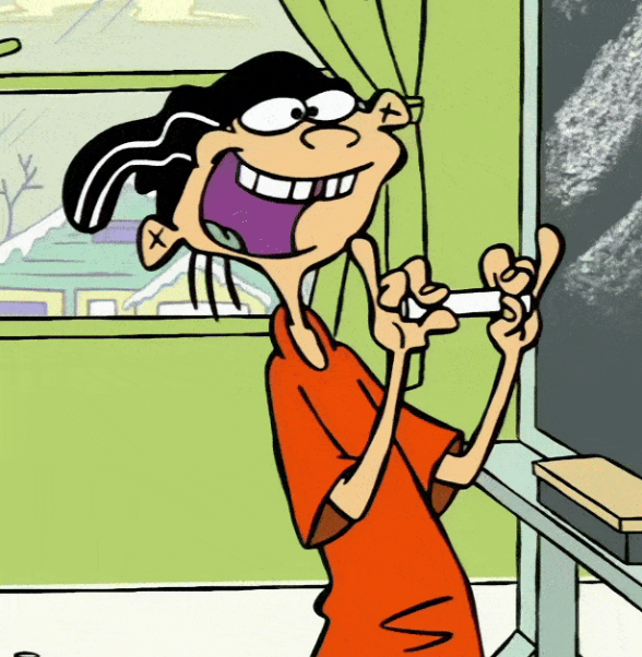 a boy in an orange shirt and a black hat grinning