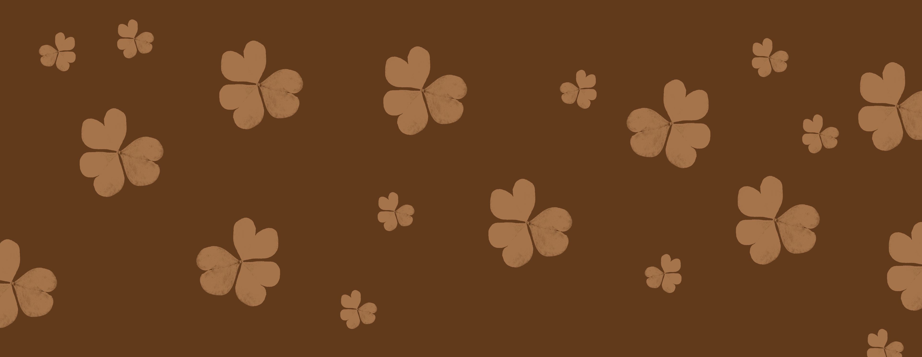 a dark brown background with lighter brown clovers on top