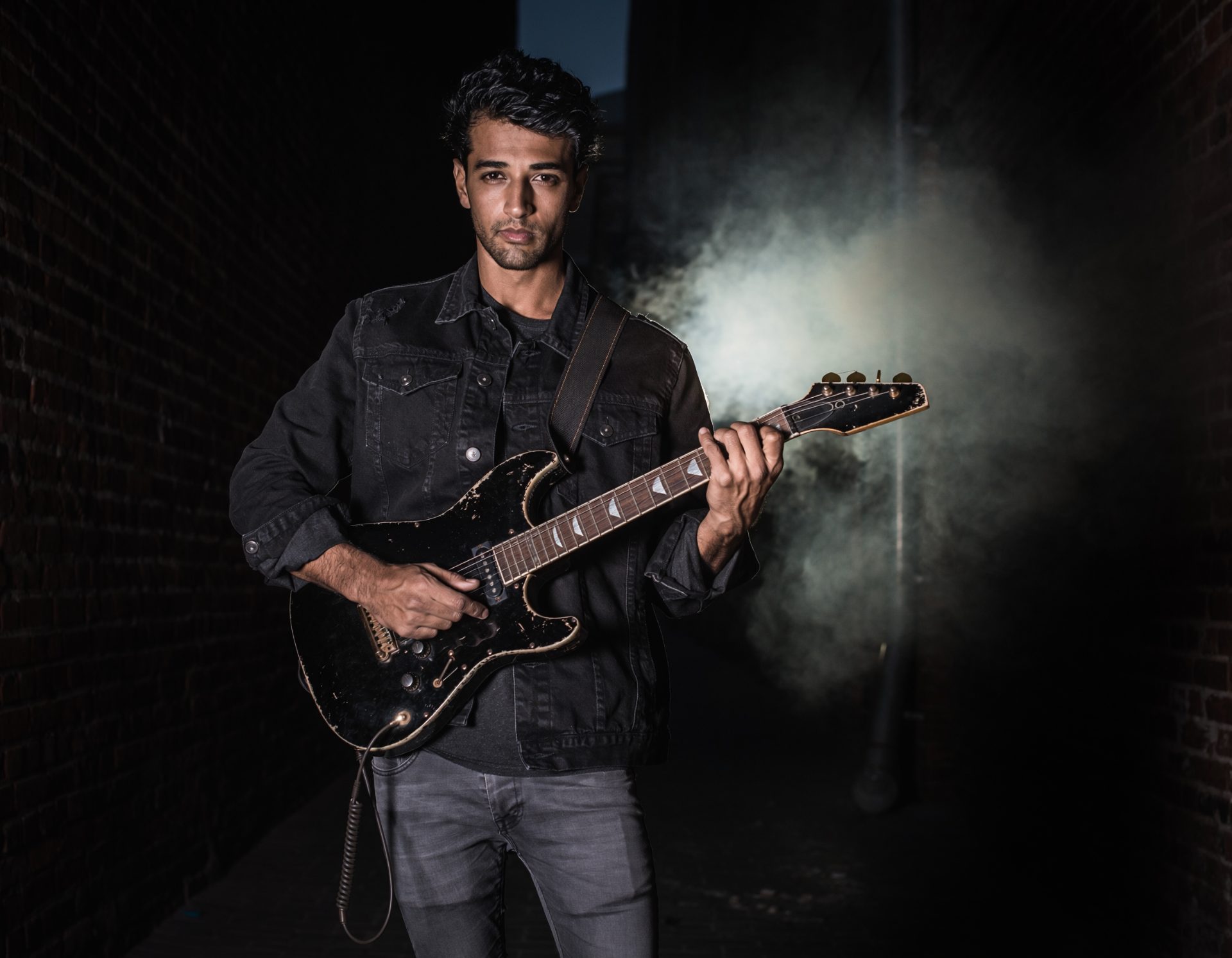 Midnight Alleyway Musician with Guitar