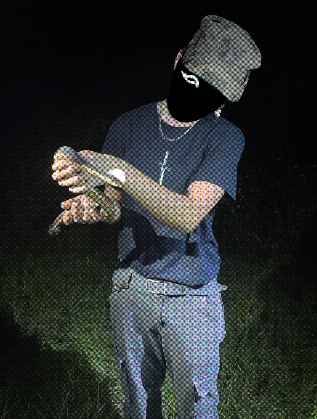 photo of me holding a banded watersnake at night