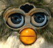 A close up gif of a Furby face