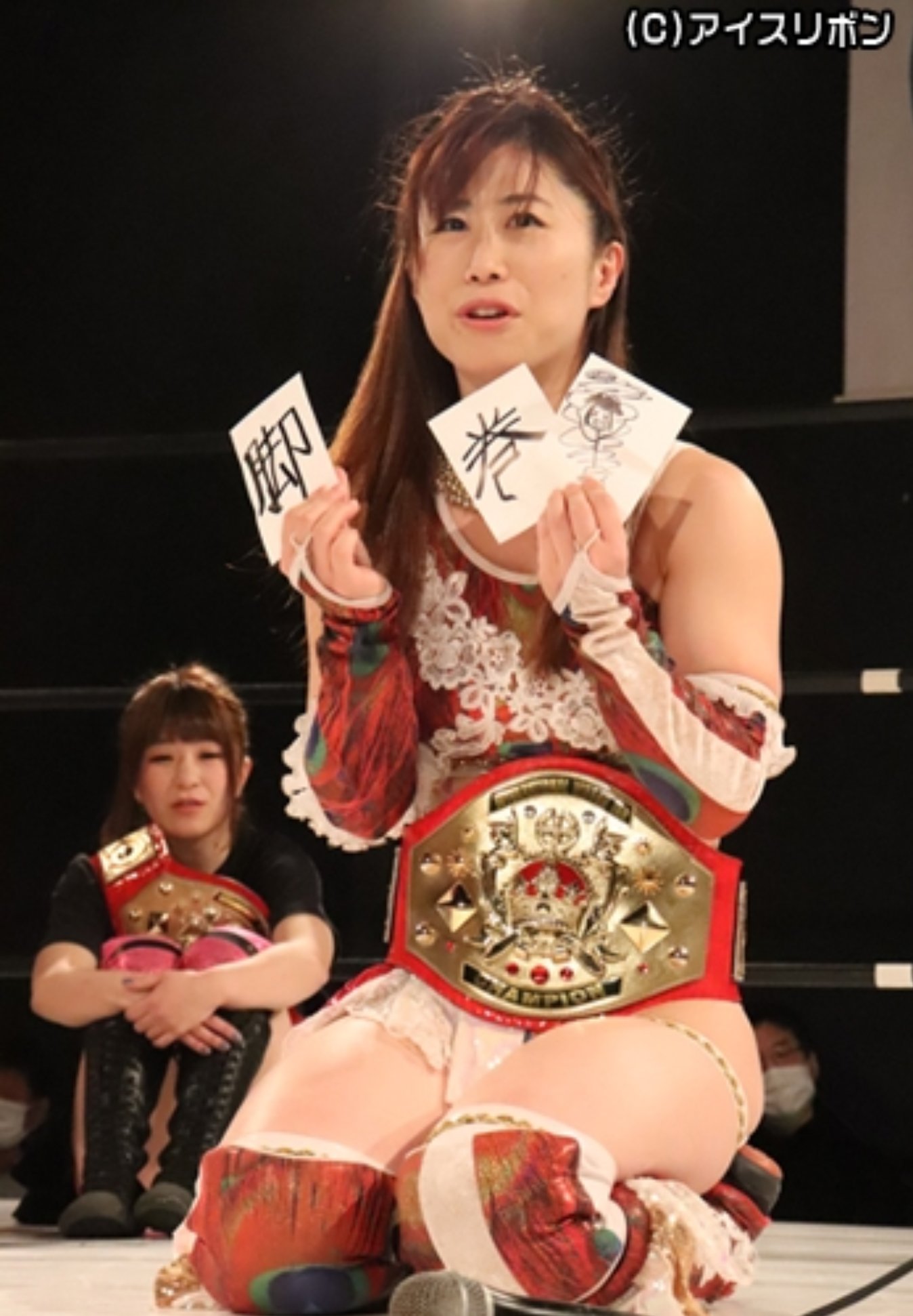 Tsukasa Fujimoto holding three paper cards that Suzu left behind containing clues about her evolution.